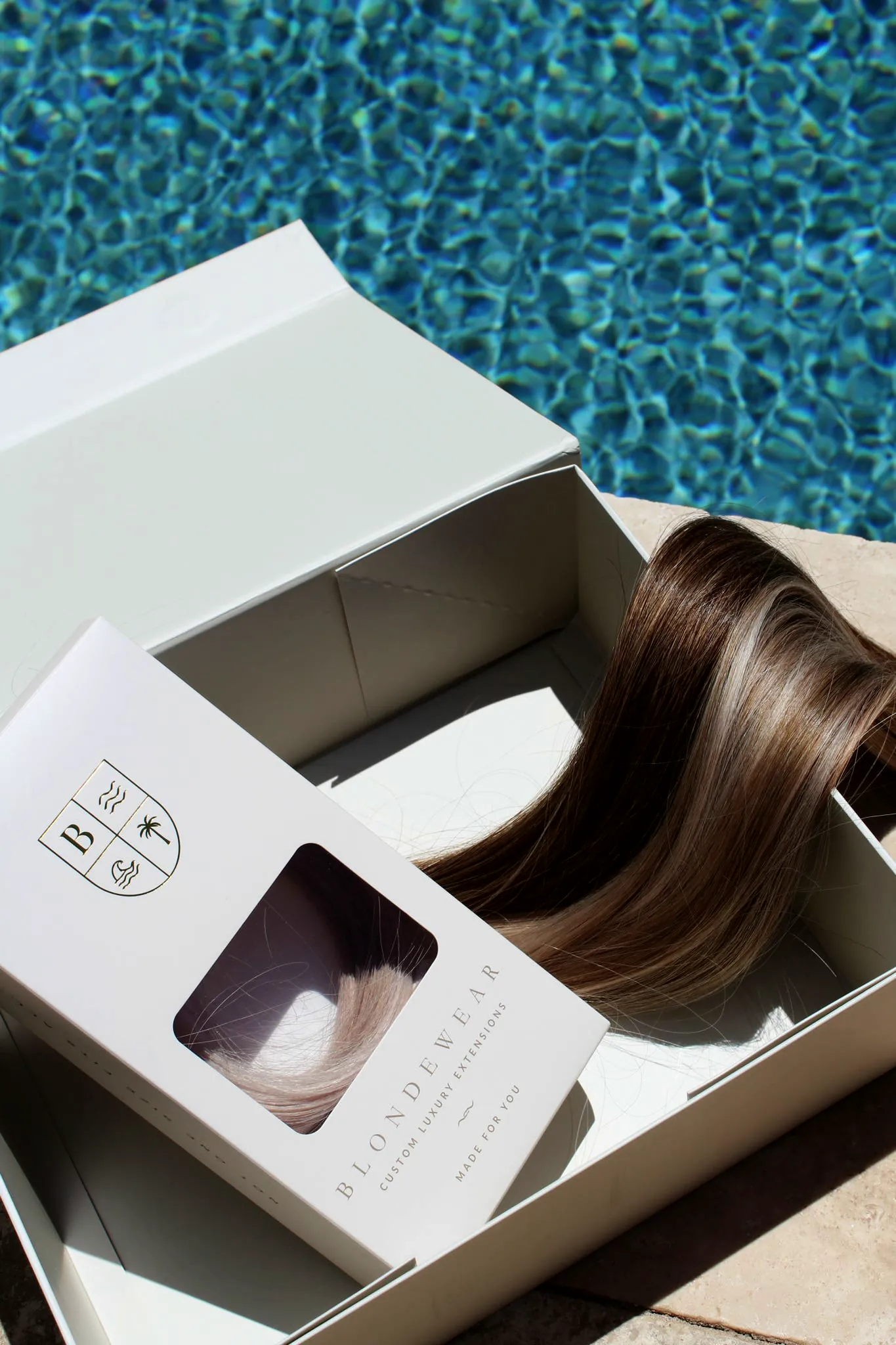 A BlondeWear extension box, open, with a bronde weft inside