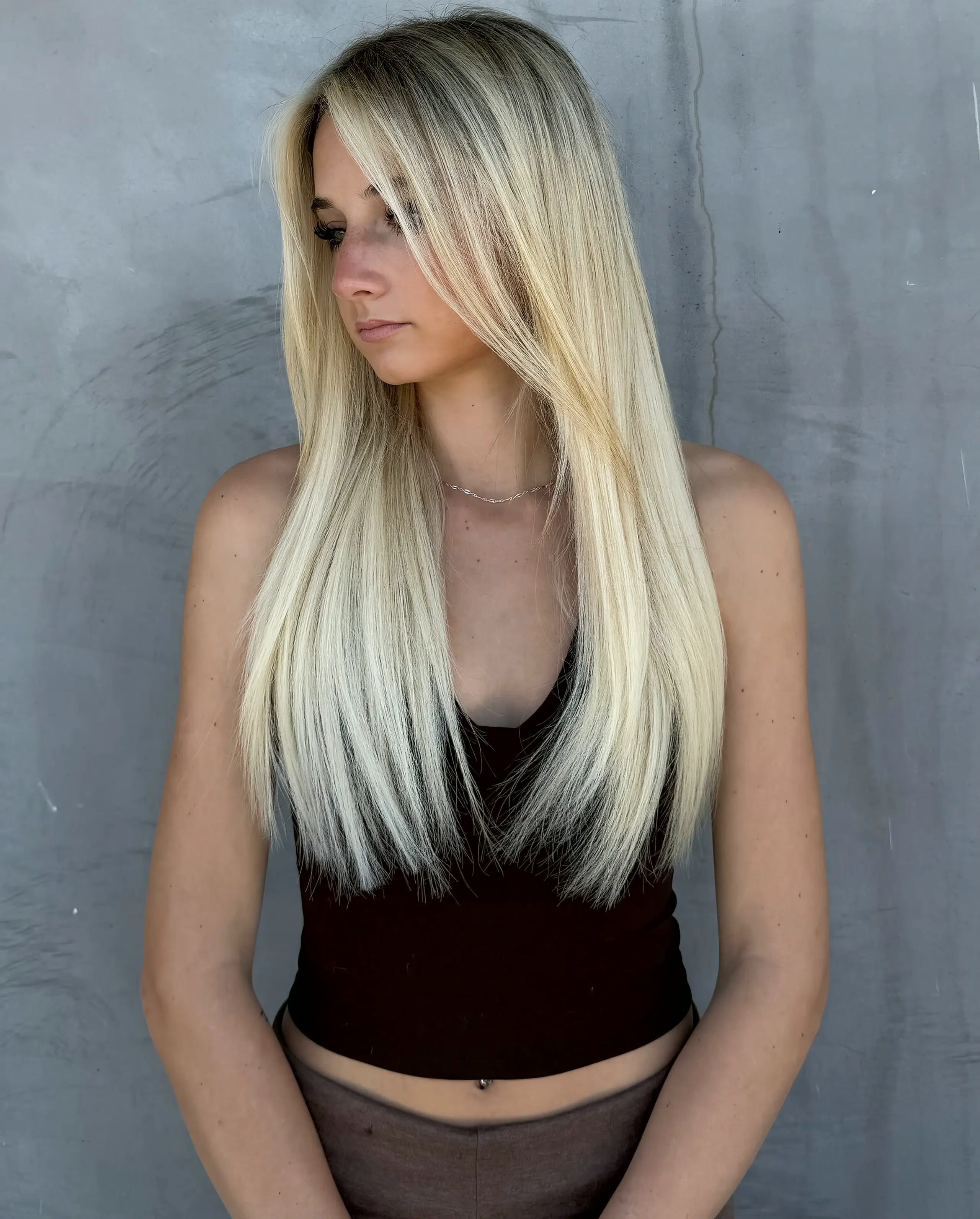 Fresh blonde color with a sleek blowout, done at Blonde Voyage